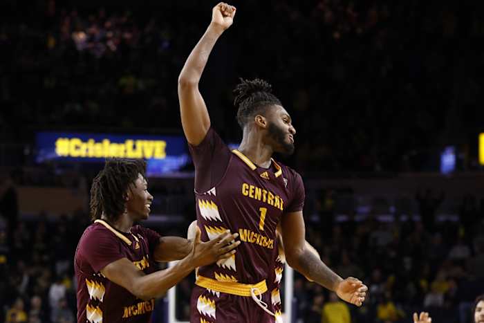 Central Michigan forward Ola Ajiboye (11) and guard Reggie Bass (1) celebrate after defeating Michigan. at Crisler Center. (Rick Osentoski-USA TODAY Sports)
